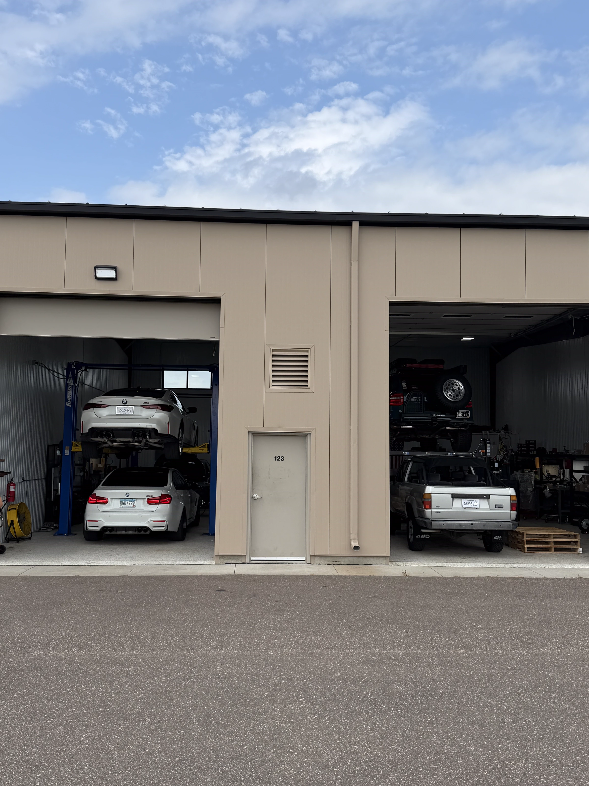 The Upgrade Shop at 663 Valerie Ave, Unit 123, with BMWs in the left bay